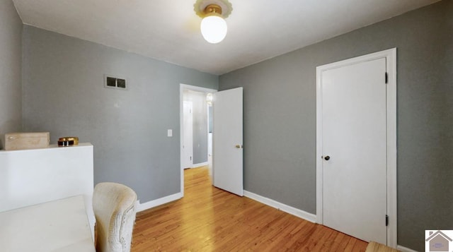 living area with light hardwood / wood-style floors