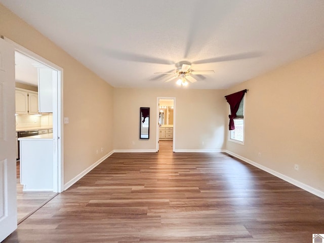 spare room with ceiling fan and light wood-type flooring