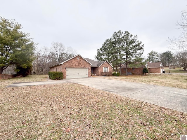 single story home with a garage and a front lawn