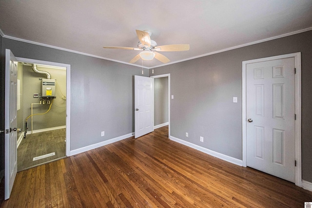 unfurnished bedroom featuring crown molding, ceiling fan, dark hardwood / wood-style flooring, and water heater