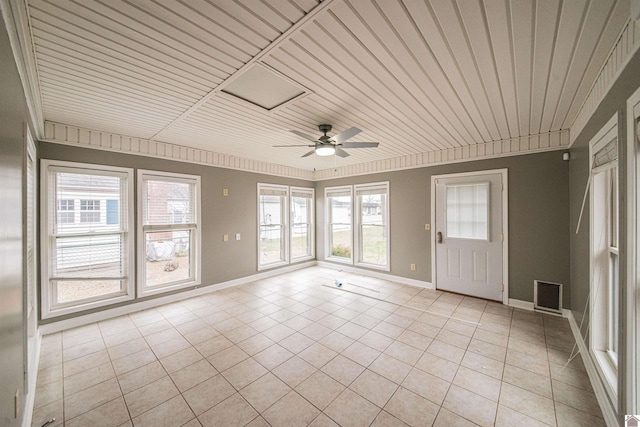 unfurnished sunroom with a wealth of natural light, wooden ceiling, and ceiling fan