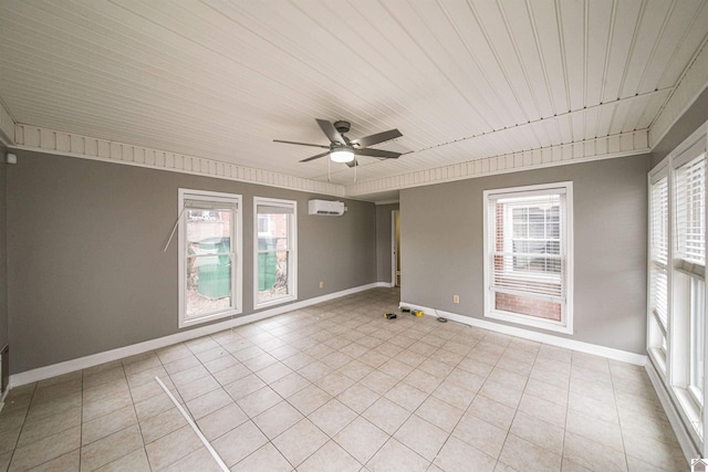 spare room with light tile patterned floors, a wall unit AC, and ceiling fan