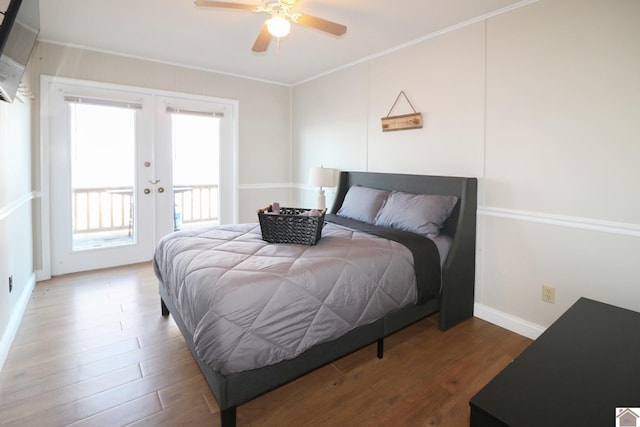 bedroom with wood-type flooring, access to outside, ceiling fan, crown molding, and french doors