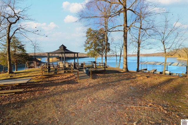 view of yard with a gazebo and a water view