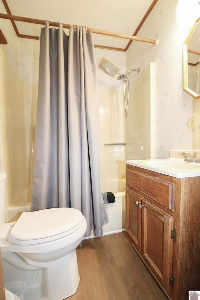 full bathroom featuring shower / tub combo with curtain, wood-type flooring, toilet, and vanity