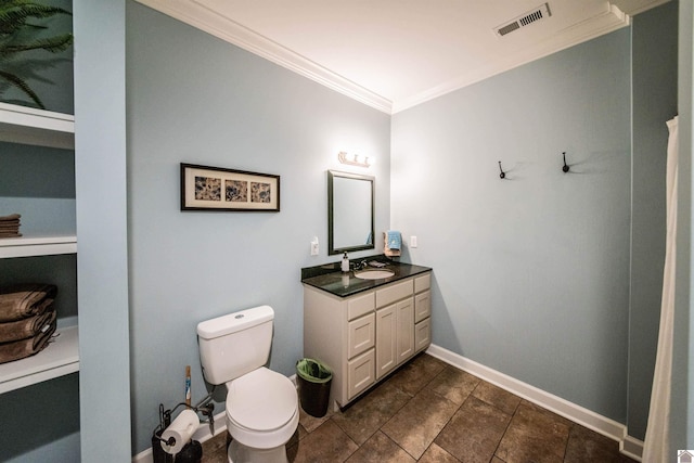 bathroom featuring vanity, ornamental molding, and toilet