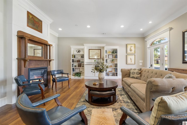 502 N 5th St, Paducah, KY 42001 - living room with a glass covered fireplace, ornamental molding, wood finished floors, and recessed lighting