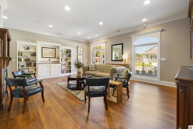 502 N 5th St, Paducah, KY 42001 - living area with crown molding, wood finished floors, recessed lighting, and baseboards