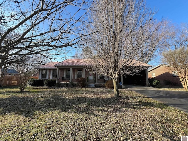 single story home with a carport and a front lawn