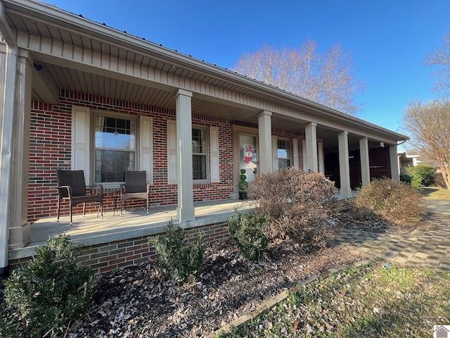 back of house with a porch