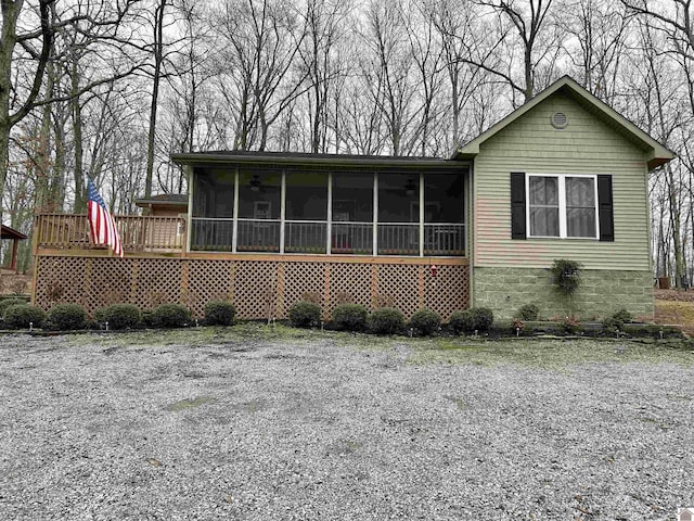 view of front of house featuring a sunroom