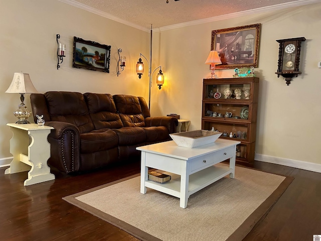 living room with dark wood-type flooring, ornamental molding, and a textured ceiling