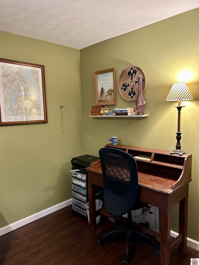 office space with dark wood-type flooring and a textured ceiling