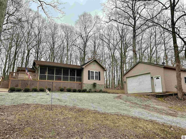 view of front of property with a front yard and a sunroom