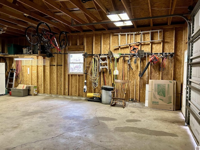 garage featuring white fridge