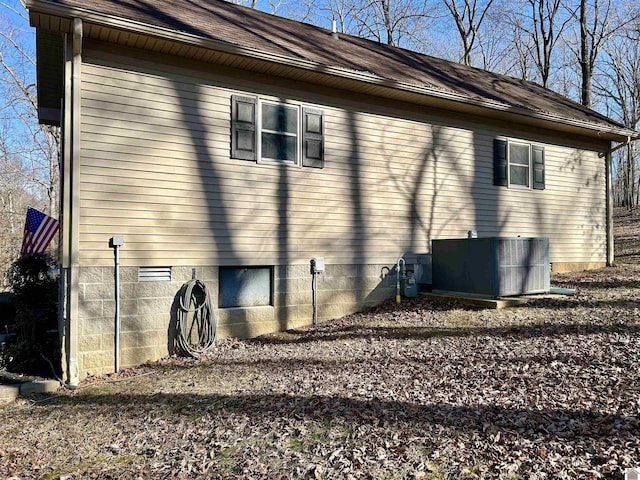 view of home's exterior with central air condition unit