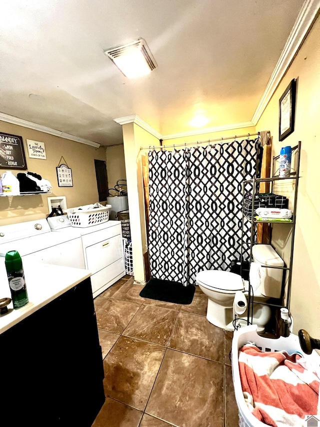 bathroom featuring crown molding, tile patterned flooring, vanity, separate washer and dryer, and toilet