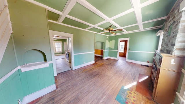 interior space featuring ceiling fan, wood-type flooring, and coffered ceiling