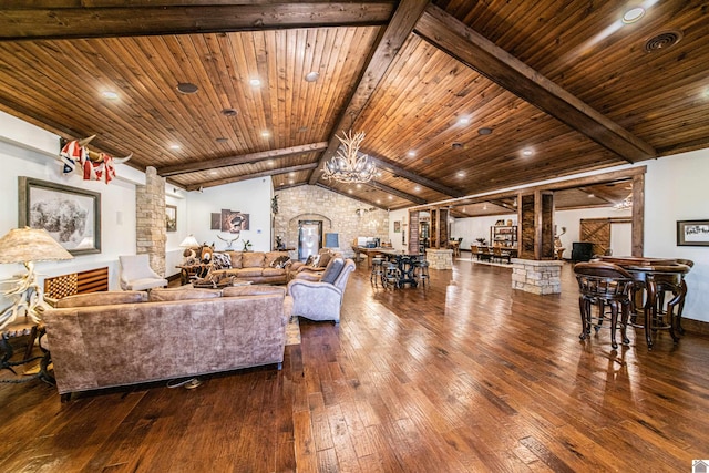 living room featuring wood-type flooring, lofted ceiling with beams, decorative columns, and wooden ceiling