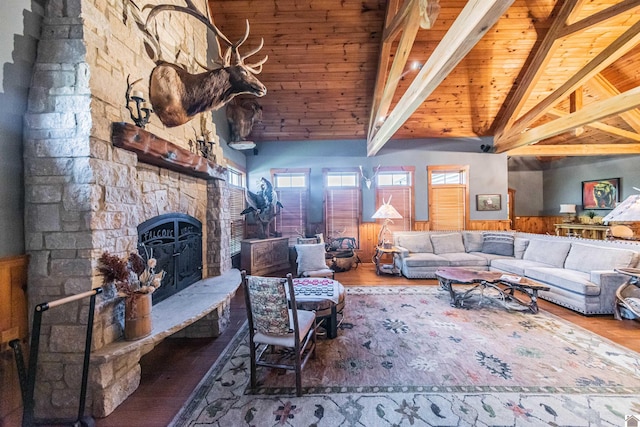 living room featuring hardwood / wood-style flooring, a fireplace, lofted ceiling with beams, and wooden ceiling