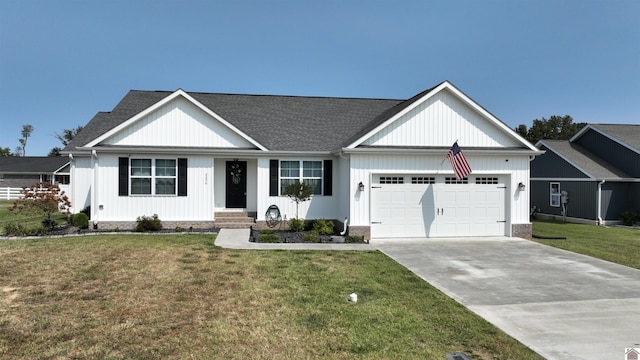 view of front facade with a garage and a front lawn