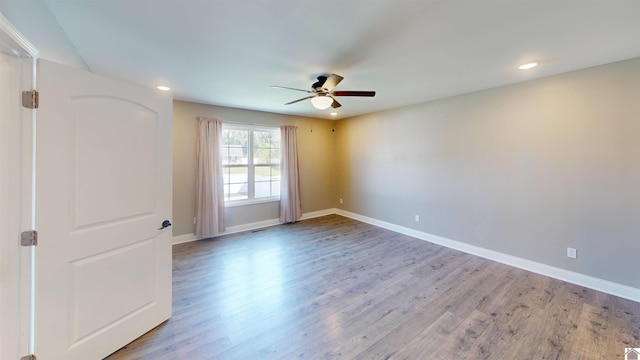 2206 Traci Dr, Murray, KY 42071 - spare room featuring baseboards, wood finished floors, recessed lighting, and ceiling fan