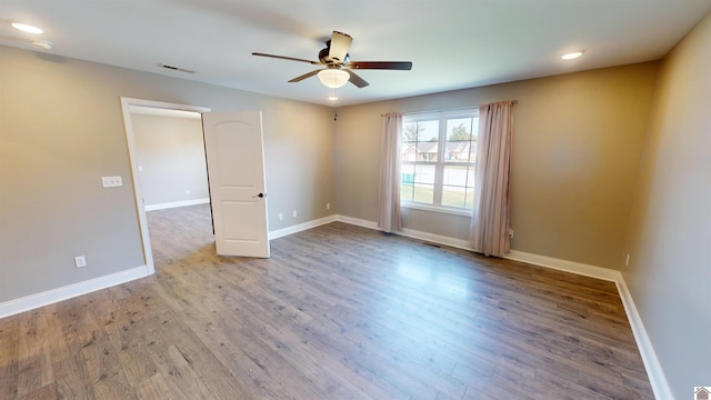2206 Traci Dr, Murray, KY 42071 - spare room with wood finished floors, baseboards, a ceiling fan, and visible vents