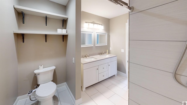 2206 Traci Dr, Murray, KY 42071 - full bath featuring double vanity, toilet, baseboards, and a sink