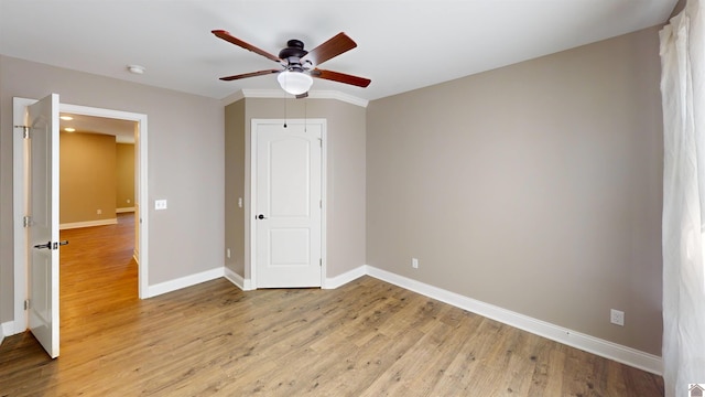 2206 Traci Dr, Murray, KY 42071 - unfurnished bedroom featuring a ceiling fan, baseboards, a closet, and light wood-type flooring