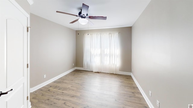 2206 Traci Dr, Murray, KY 42071 - unfurnished room featuring a ceiling fan, baseboards, and light wood-style flooring
