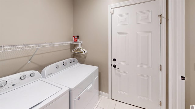 2206 Traci Dr, Murray, KY 42071 - washroom with washing machine and dryer, light tile patterned flooring, and laundry area