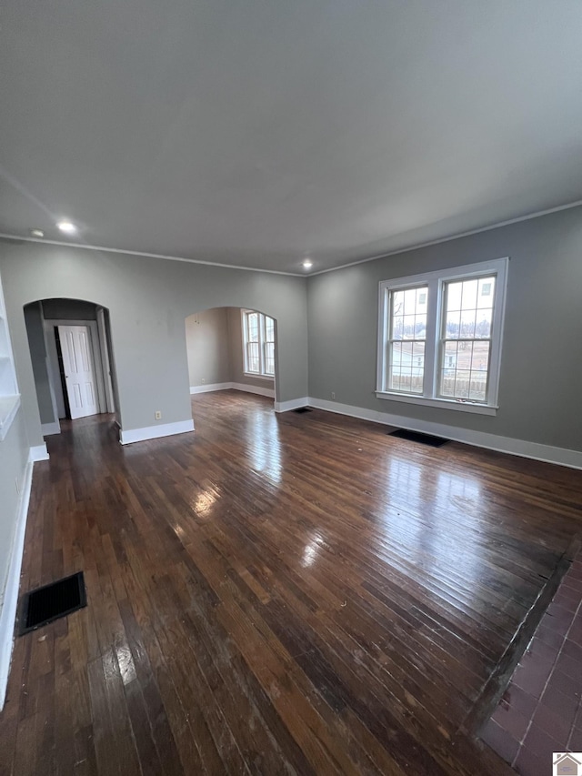 empty room featuring dark hardwood / wood-style flooring