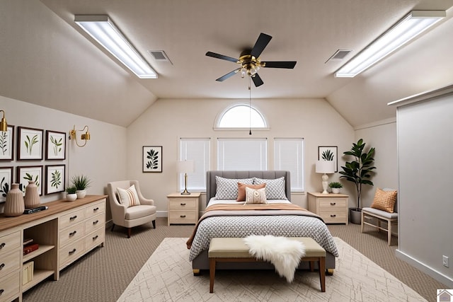 bedroom featuring carpet flooring, visible vents, and lofted ceiling