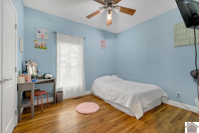 bedroom featuring hardwood / wood-style floors and ceiling fan