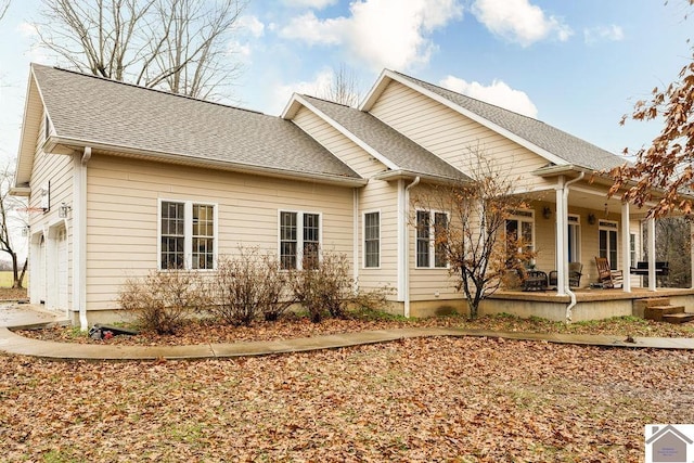 back of house featuring covered porch