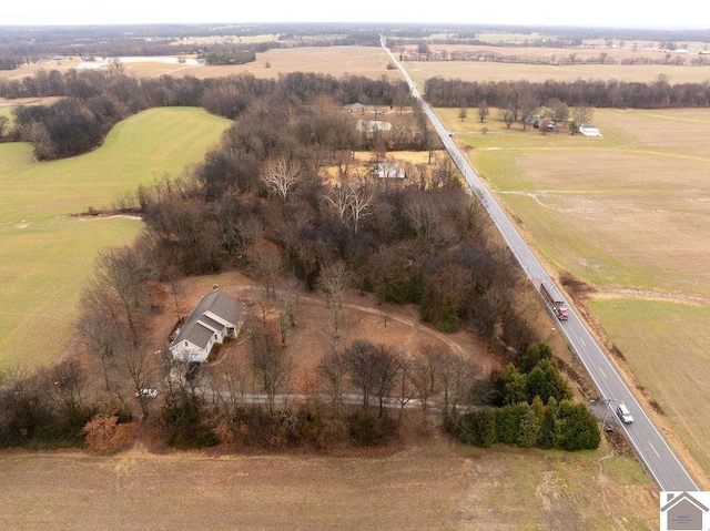 birds eye view of property with a rural view