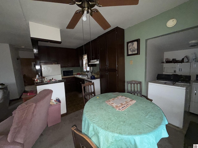 dining area featuring ceiling fan and light colored carpet