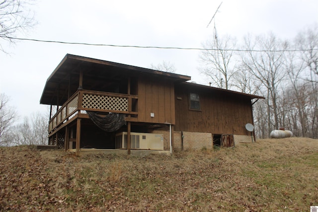 view of side of property with a wooden deck