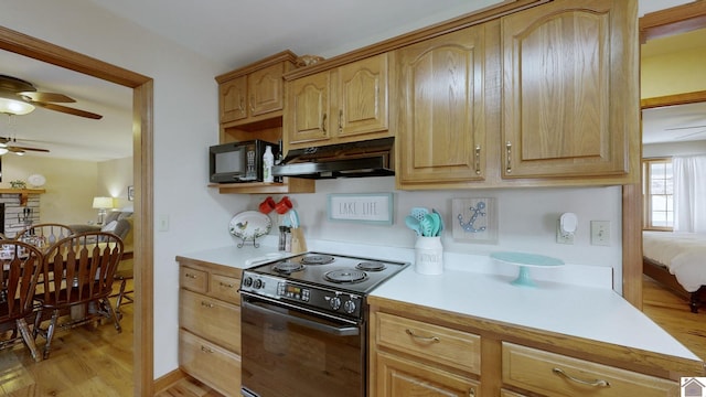 kitchen with ceiling fan, light wood-type flooring, and black appliances