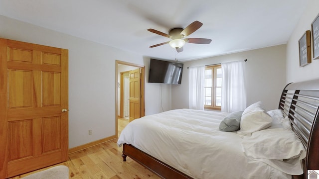 bedroom with ceiling fan and light hardwood / wood-style flooring