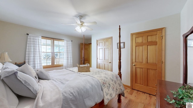 bedroom featuring ceiling fan and light hardwood / wood-style flooring