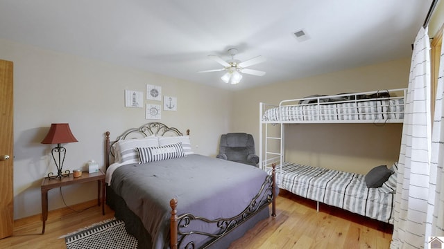 bedroom featuring hardwood / wood-style flooring and ceiling fan