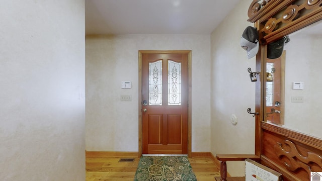 entrance foyer with light hardwood / wood-style flooring