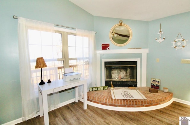 sitting room with wood-type flooring