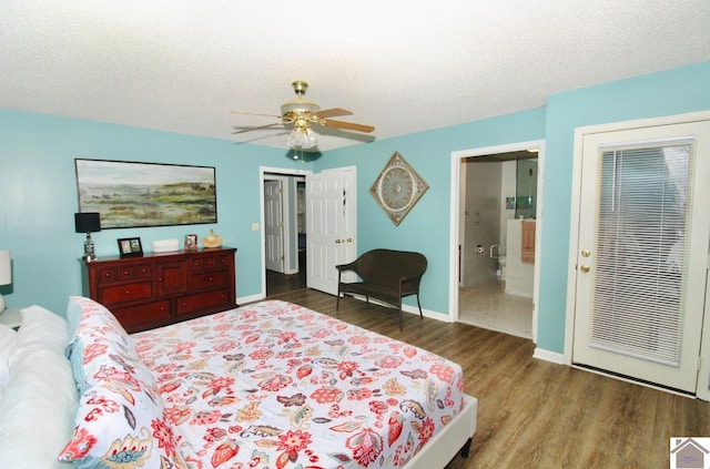 bedroom featuring ceiling fan, a textured ceiling, and dark hardwood / wood-style flooring