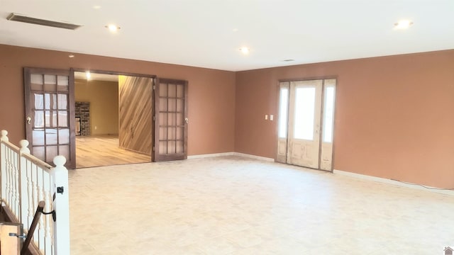 spare room featuring french doors