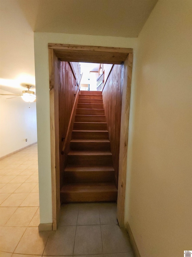 stairway with tile patterned flooring and ceiling fan