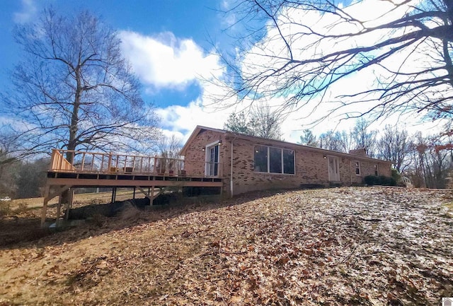 view of side of property featuring a deck