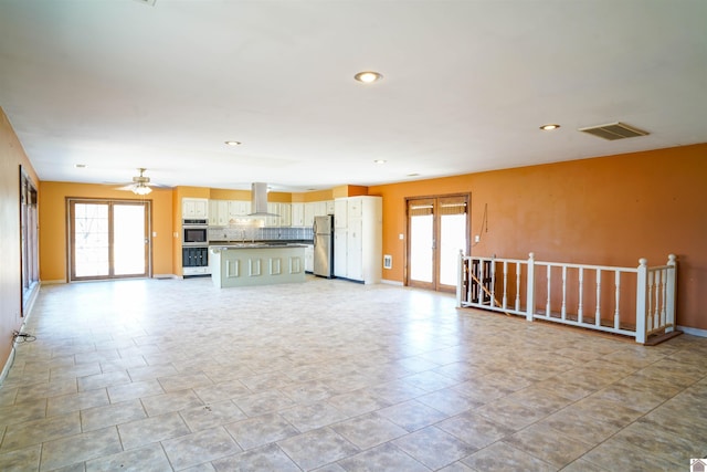 unfurnished living room with a healthy amount of sunlight