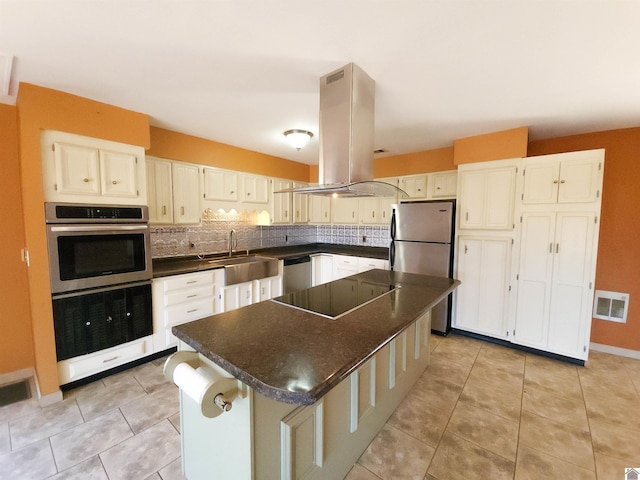 kitchen featuring sink, a center island, light tile patterned floors, appliances with stainless steel finishes, and island exhaust hood